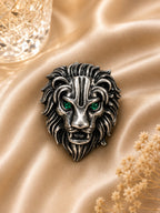 Silver Lion Brooch with Emerald Green Crystal Eyes